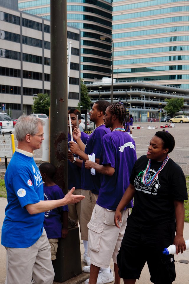Sen. John Marty greets the drummers at Twin Cities Pride.